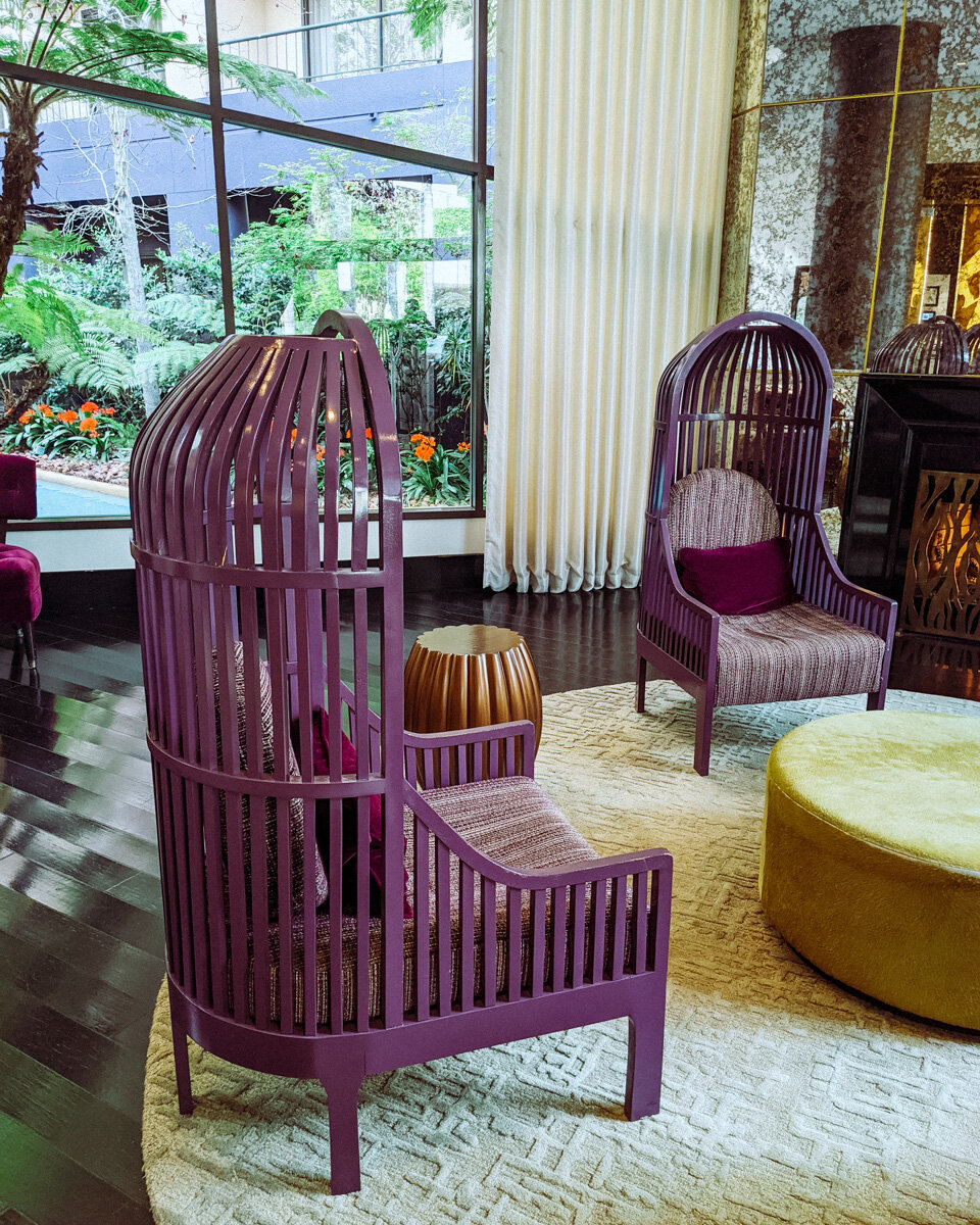 Rachel Off Duty: Large Purple Birdcage Chairs in a Hotel Lobby