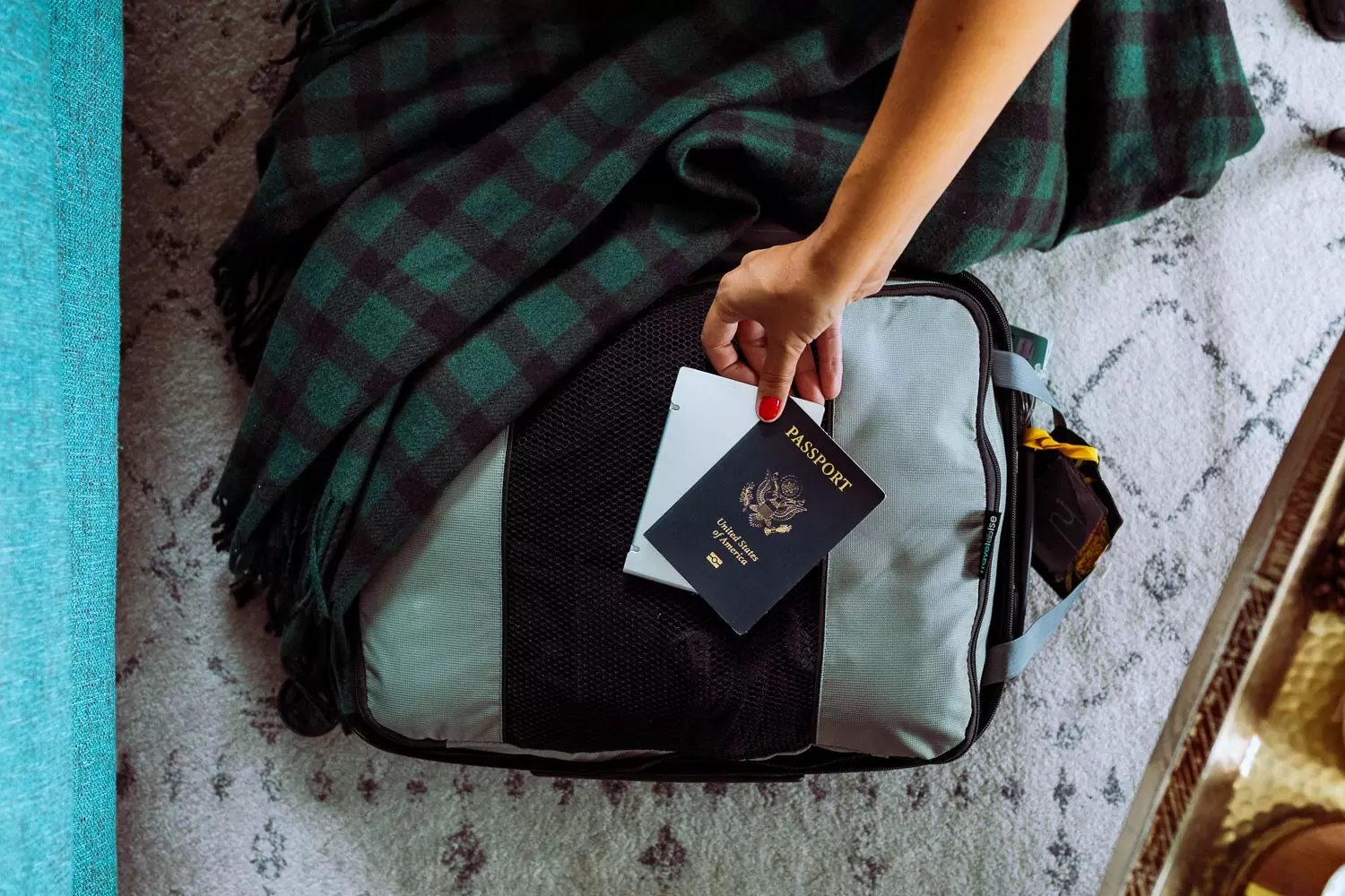 Rachel Off Duty: Woman Reaching for a Passport and Suitcase