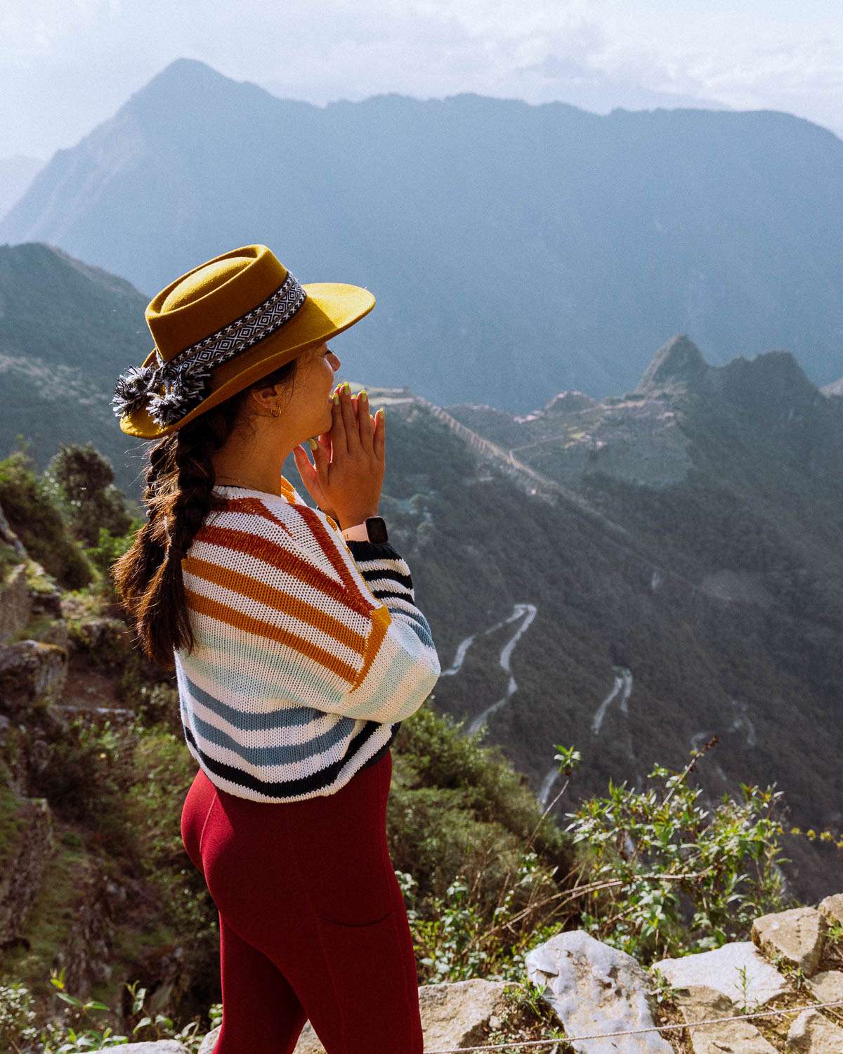 Rachel Off Duty: Woman in Rainbow Sweater Smiling at Sun Gate, Machu Picchu
