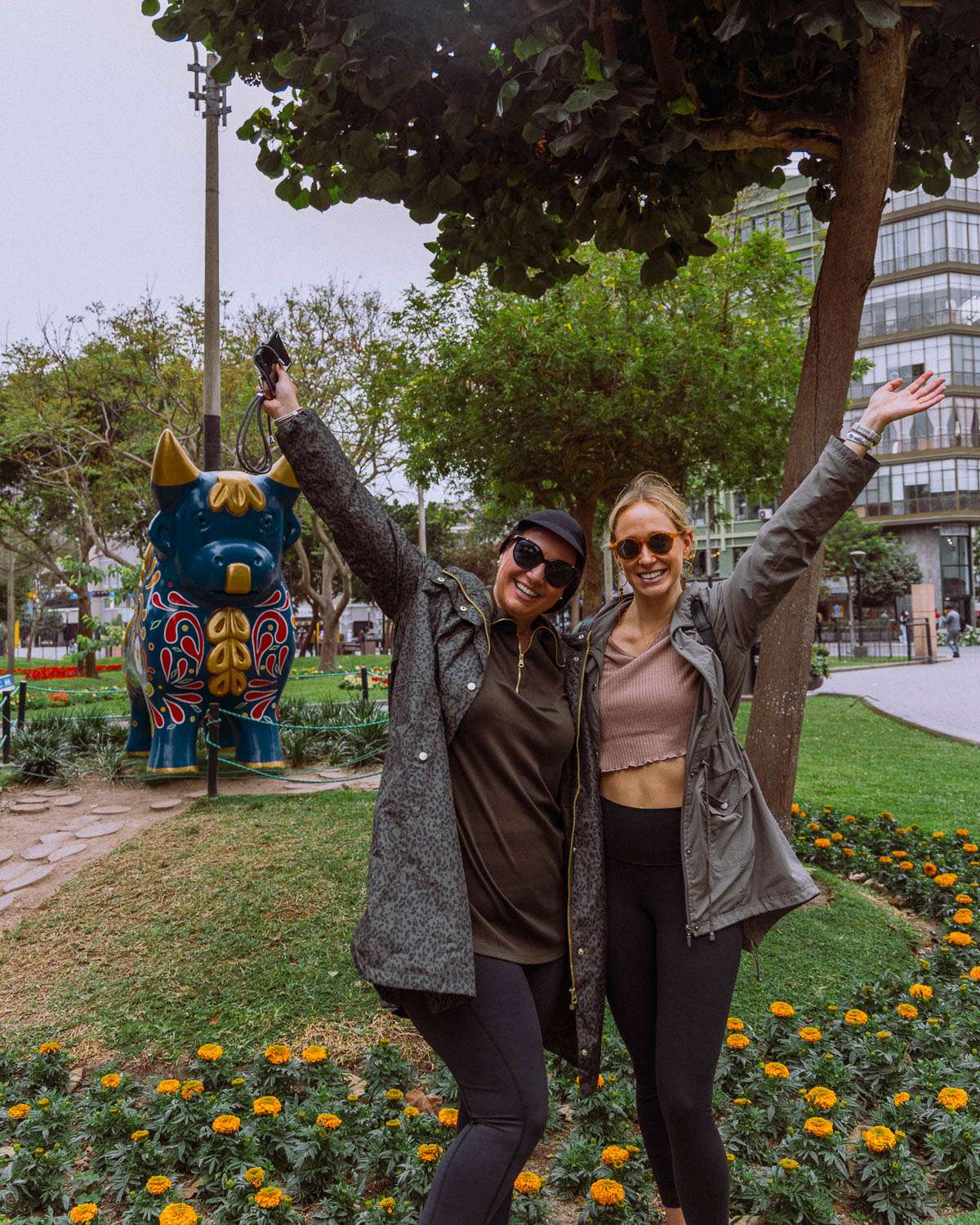 Rachel Off Duty - Two Women Posing with Raised Hands in Lima, Peru